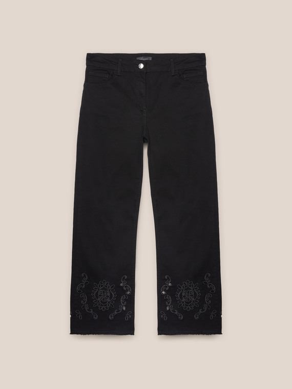 Trousers with embroidery at the bottom