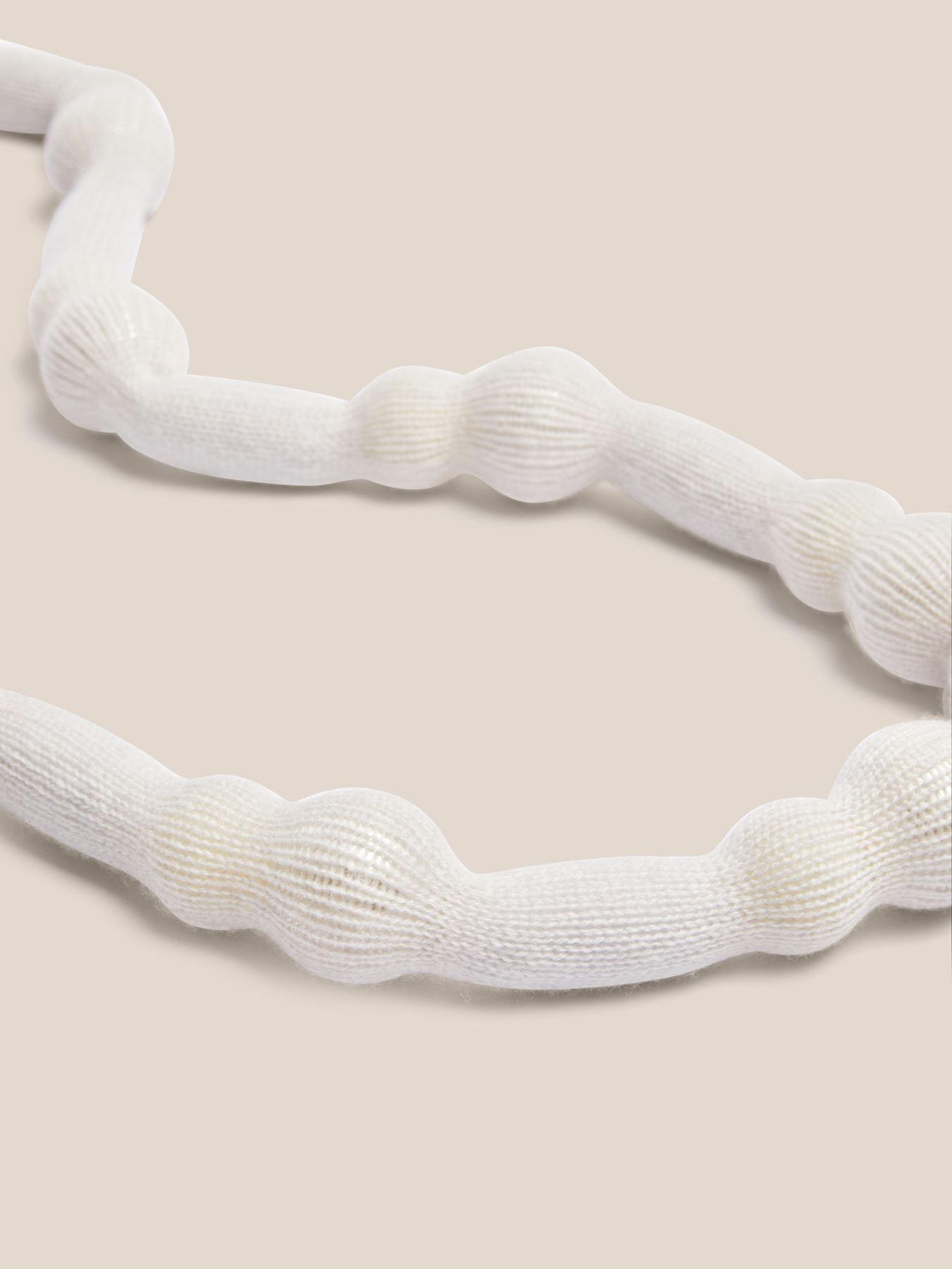 Tubular knit necklace with spheres image number 0