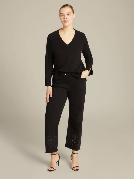 Trousers with embroidered hem