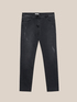 Slightly distressed skinny jeans image number 3