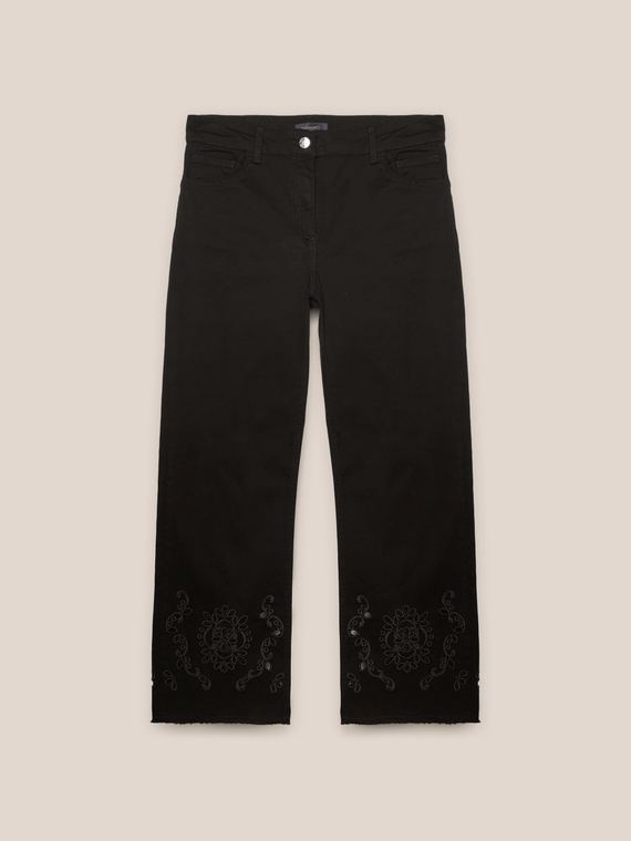 Trousers with embroidered hem
