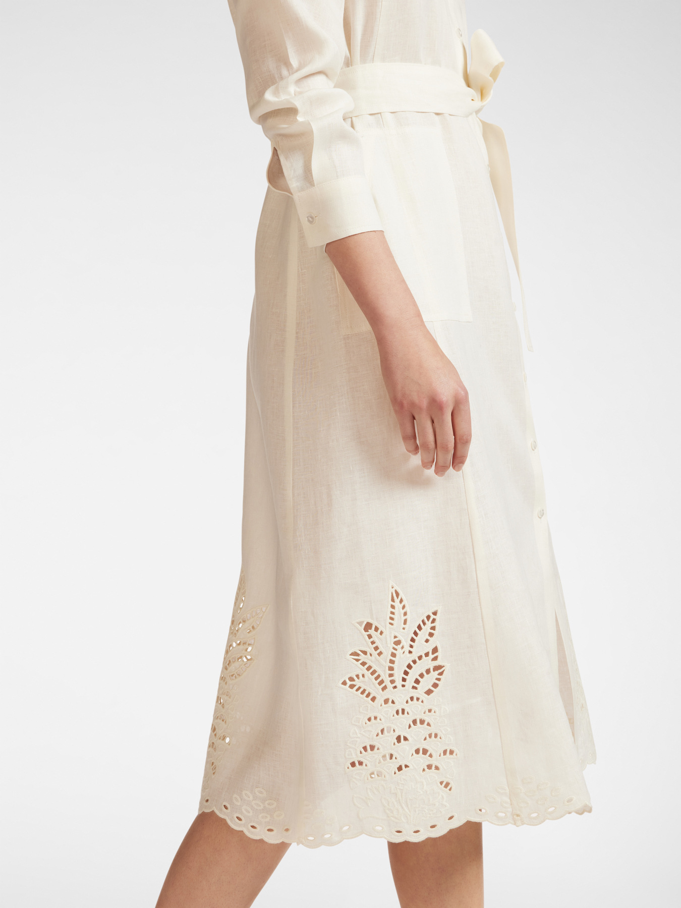 Linen dress with embroidered hem