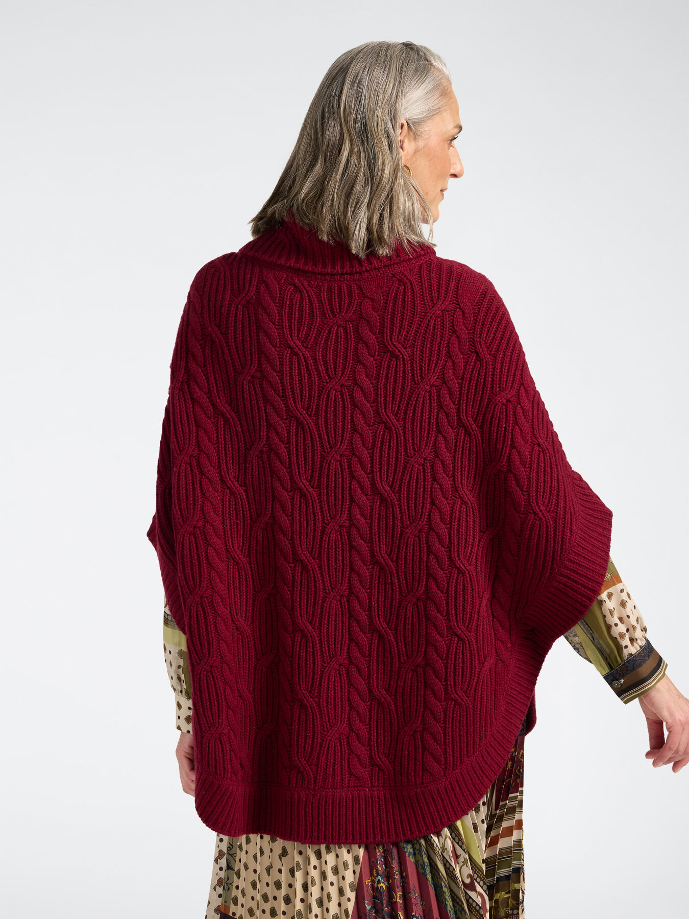 Cable knit poncho in pure wool image number 1