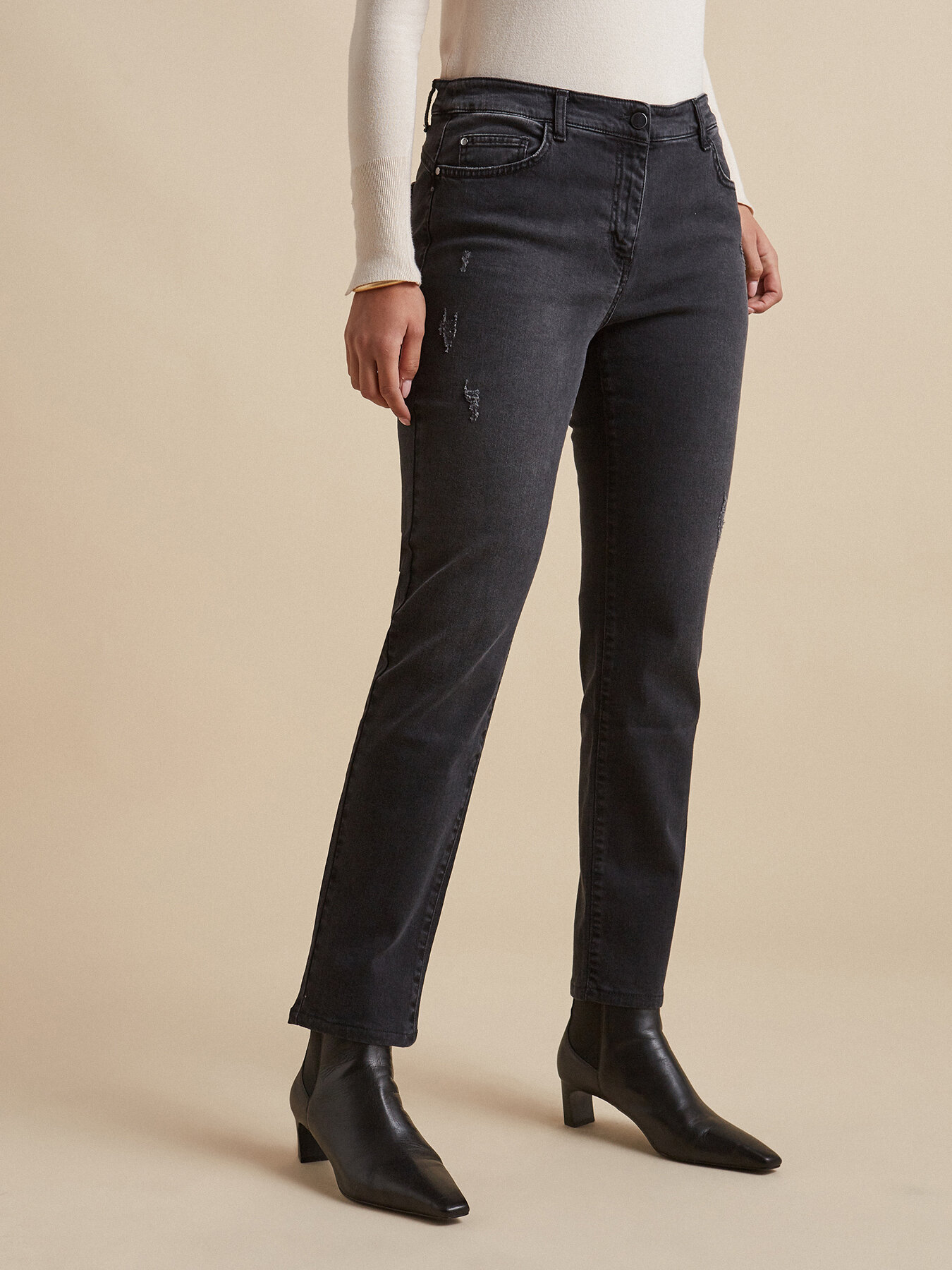 Slightly distressed skinny jeans image number 2