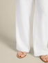 Linen trousers with fringes at the hem image number 3
